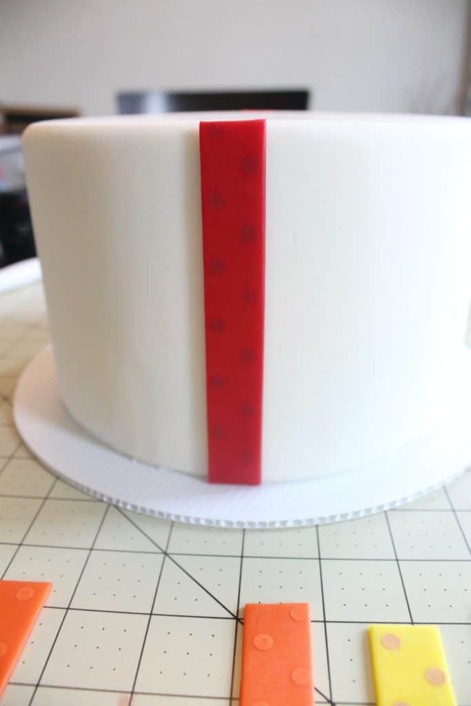 Attaching first strip of fondant