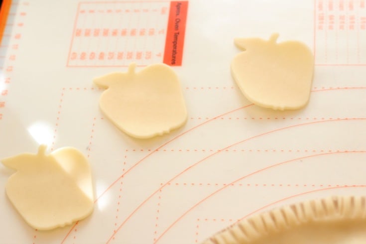 cutting out the apple shapes from pie crust