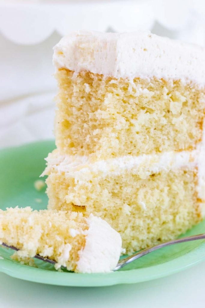 Vanilla Bean Cake on a green plate with fork