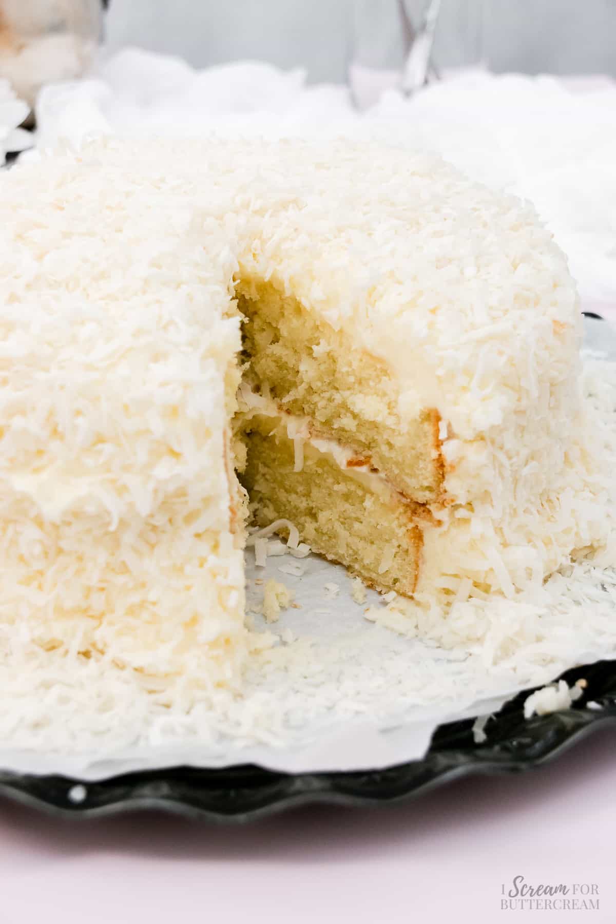Cake with shredded coconut covering it.