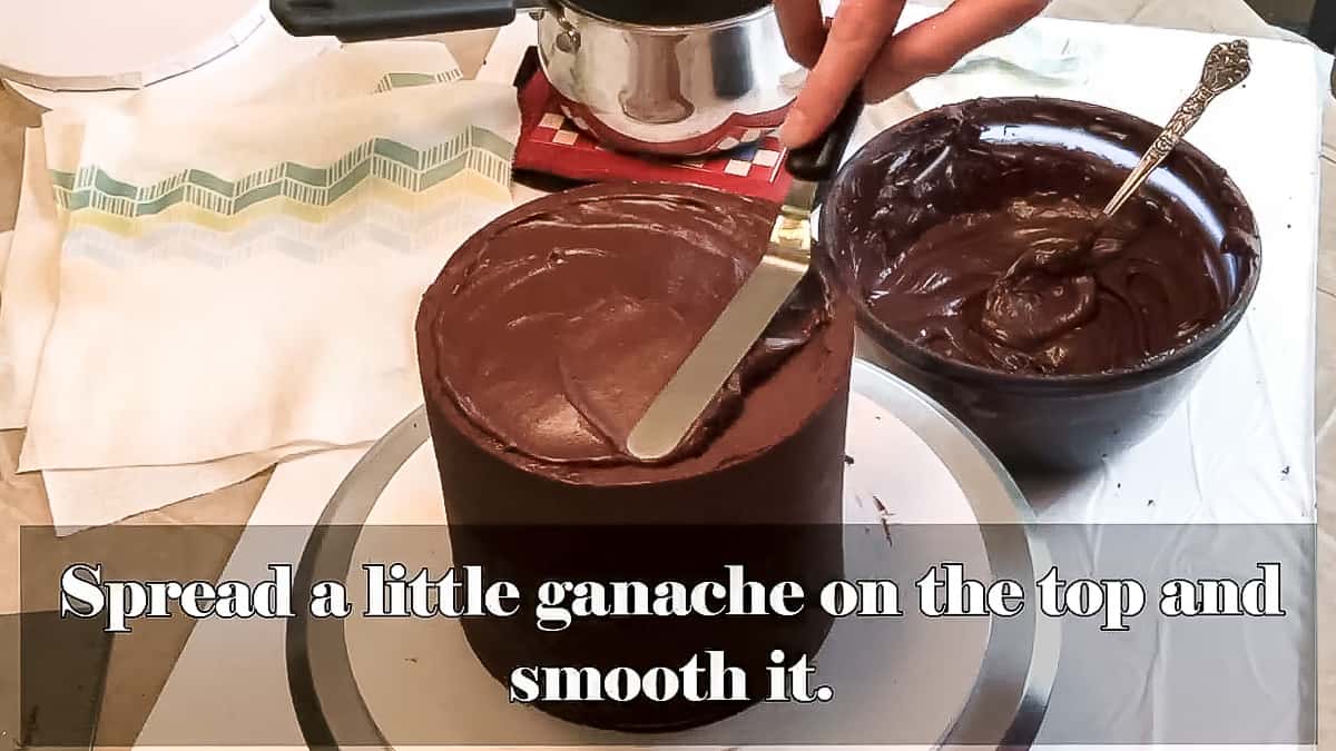 Spread a thin layer of ganache on top of cake.