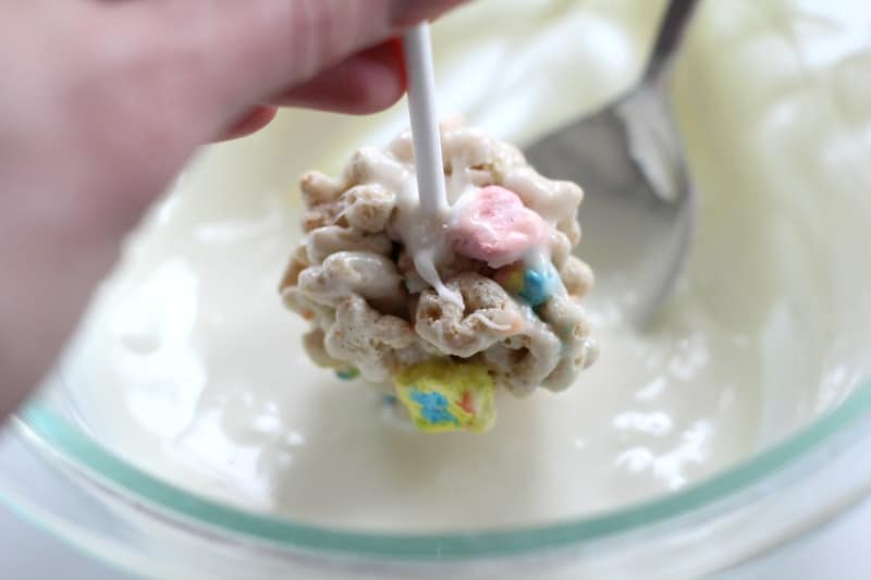 Dipping the cereal pops into white chocolate