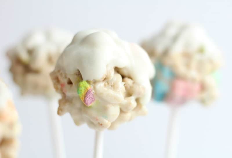 Lucky Charms White Chocolate Cereal Pops in front of white background