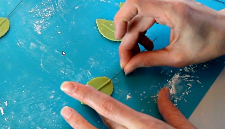 Inserting wire into gumpaste leaves