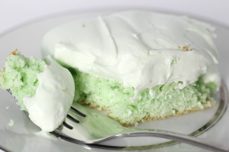 Key Lime Pie Cake Bar on a white plate with a fork