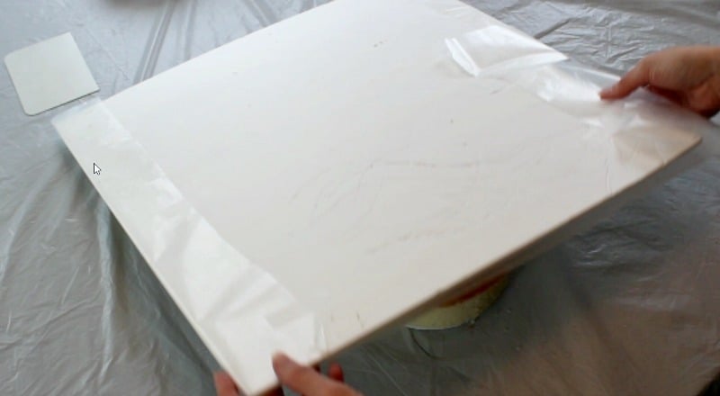 covering the large square cake board