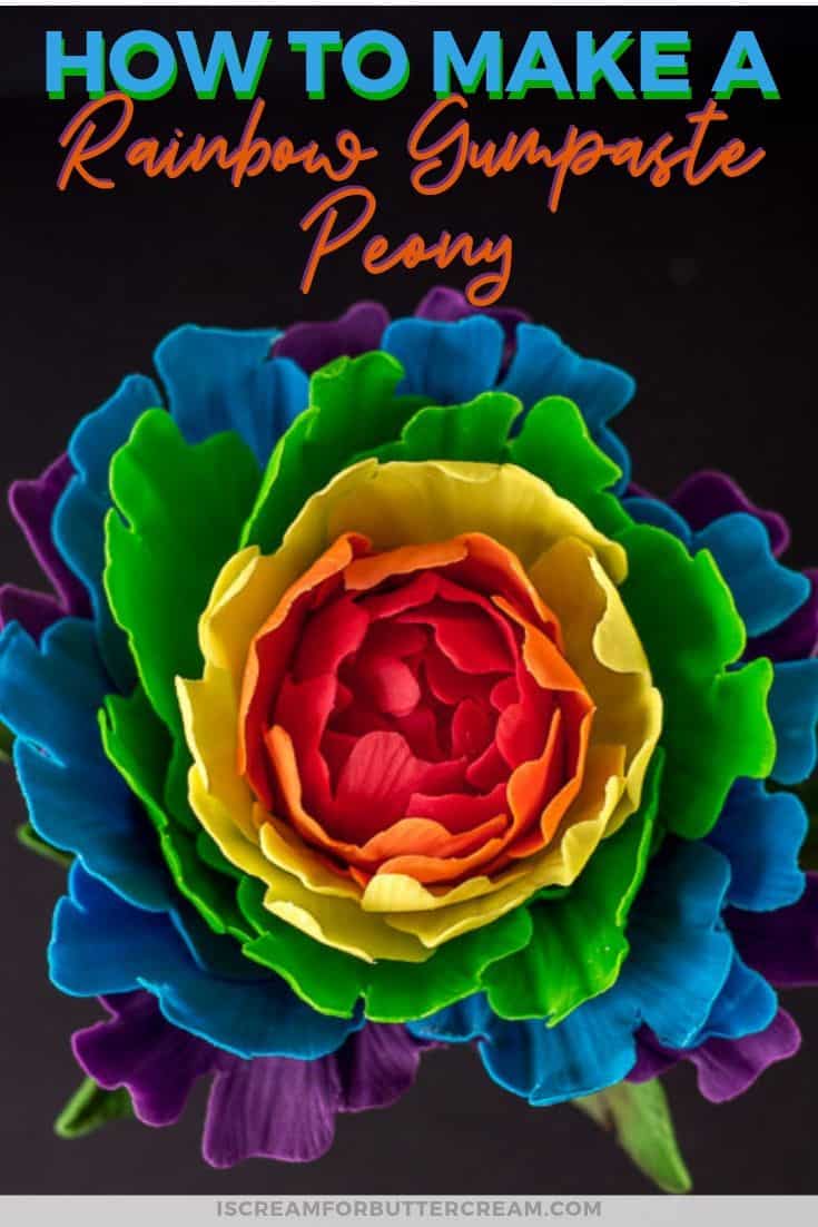 Close up of rainbow peony gumpaste flower with text overlay for pin graphic.