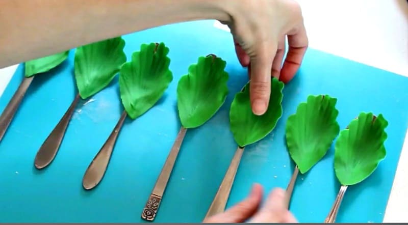 Drying green gumpaste peony petals on spoons