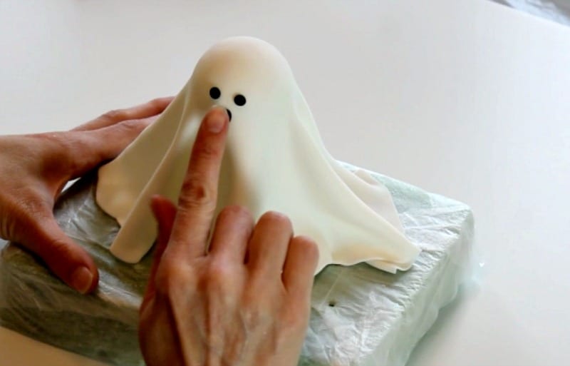 Attaching the fondant ghost mouth