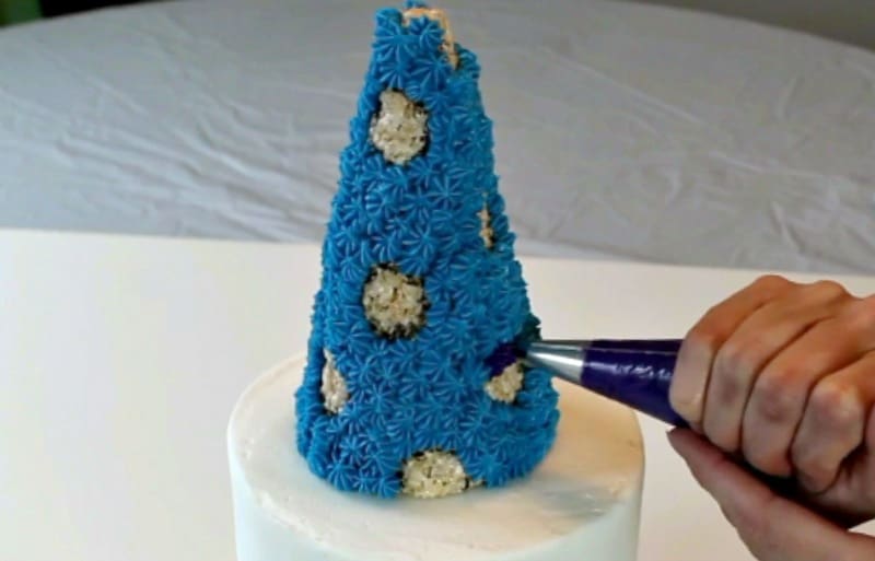 Piping onto rice krispie hat cake topper