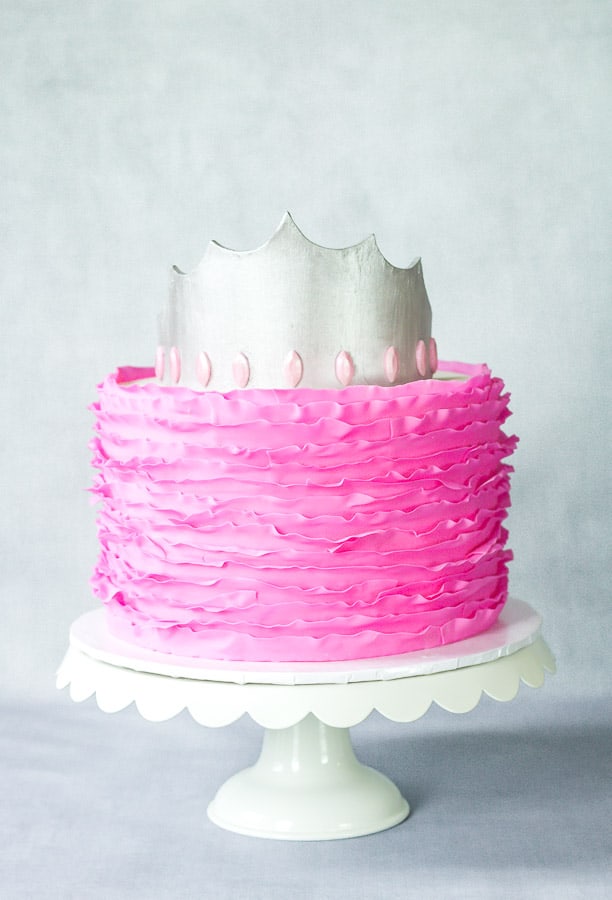 Silver Fondant Crown on top of pink fondant ruffle cake