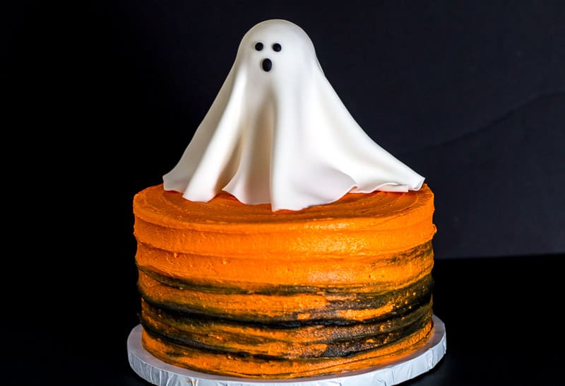 Glowing Fondant Ghost on orange and black cake