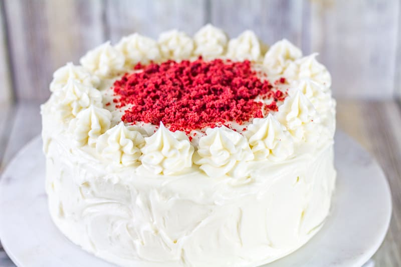 Sour Cream Red Velvet Cake on a white marble cake stand