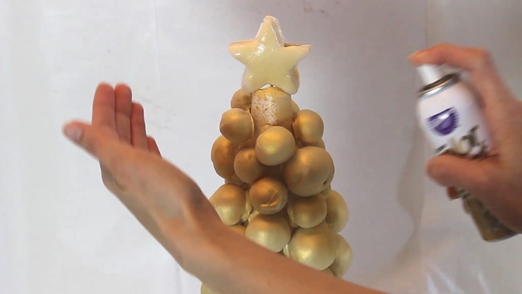 Spraying the Cake Pop Christmas Tree