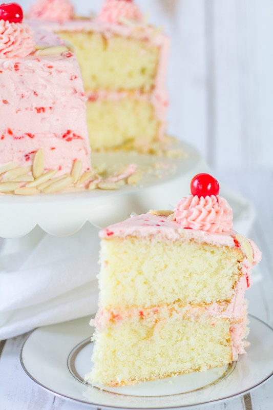 slice of the almond cake with cherry buttercream