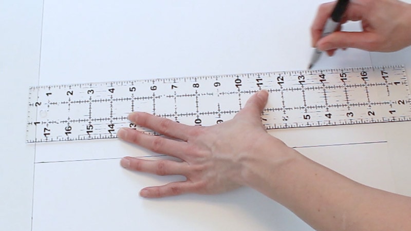 drawing the line connecting the measurements on poster board