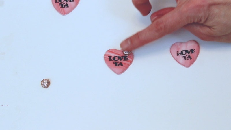 adding fondant embellishments to fondant hearts