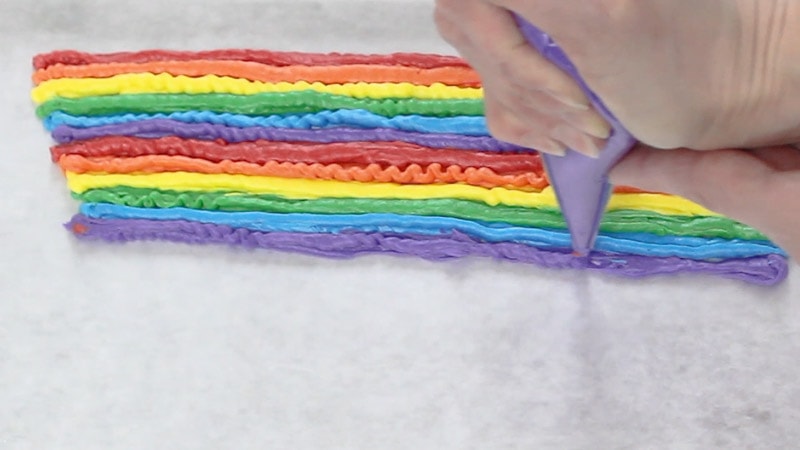 piping over each rainbow buttercream line again