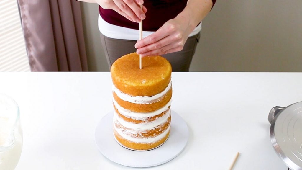 Insert center dowel into cake