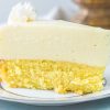 Slice of cake bottom lemon cheesecake on a white platee