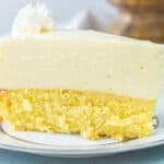 Slice of cake bottom lemon cheesecake on a white platee