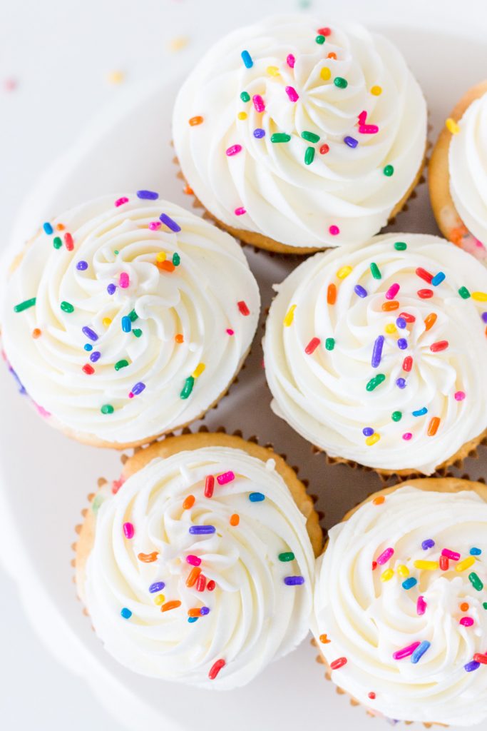 top down view of cupcakes with sprinkles on a cake stand