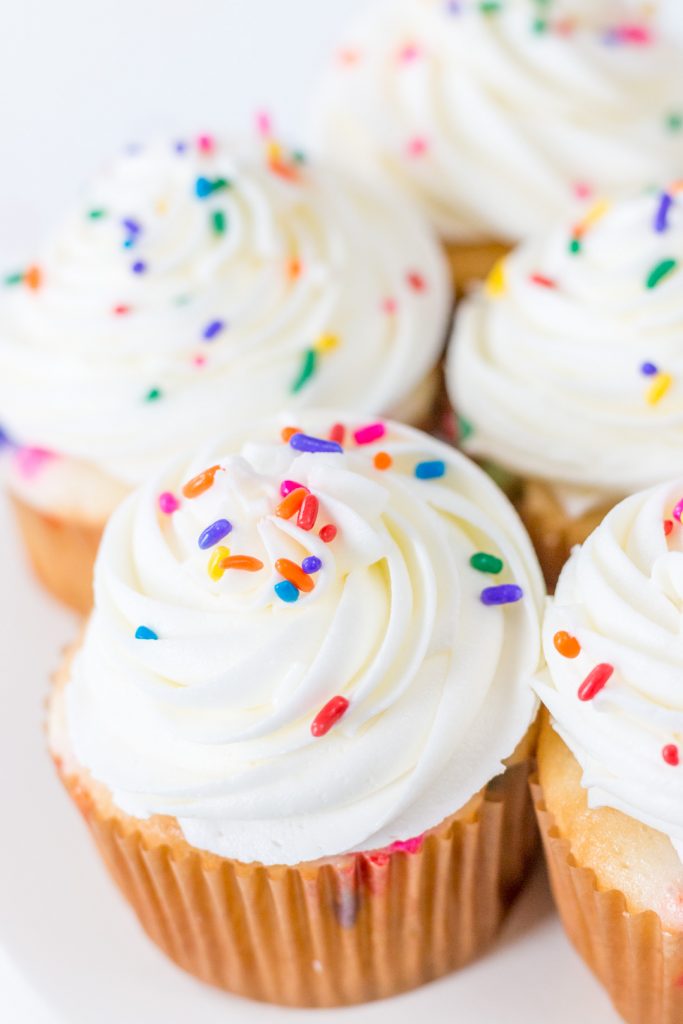 funfetti cupcakes with sprinkles and white icing