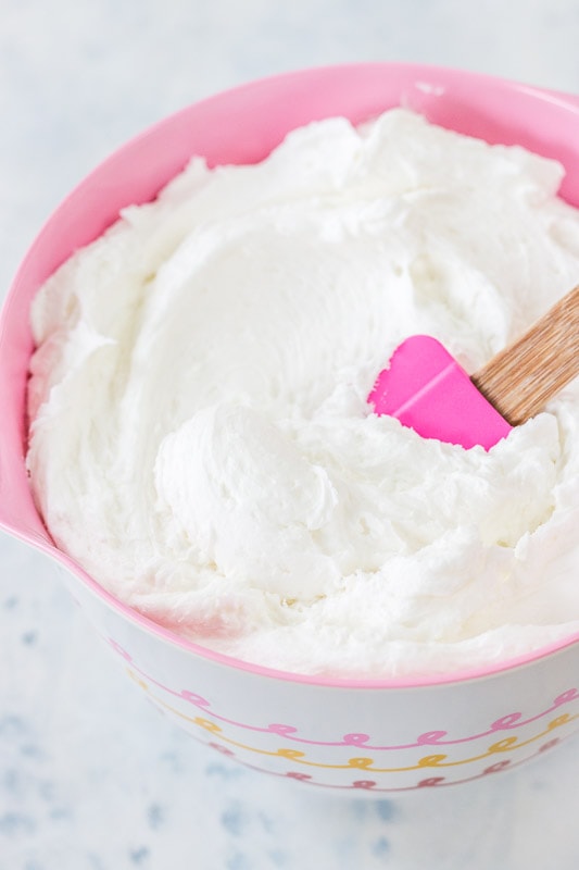 white buttercream in a pink bowl