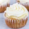 Hummingbird cheesecake topped cupcake with cream cheese buttercream swirl on top