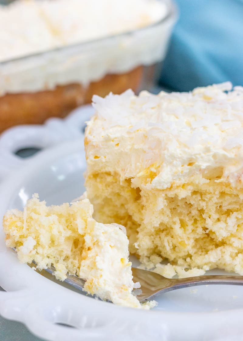 Slice of pineapple coconut cake with a fork