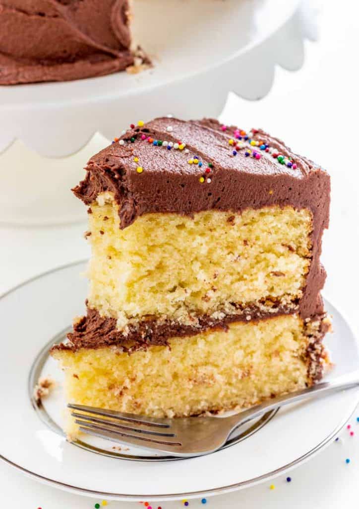 Classic Yellow Cake with Fudge Frosting with bite taken out