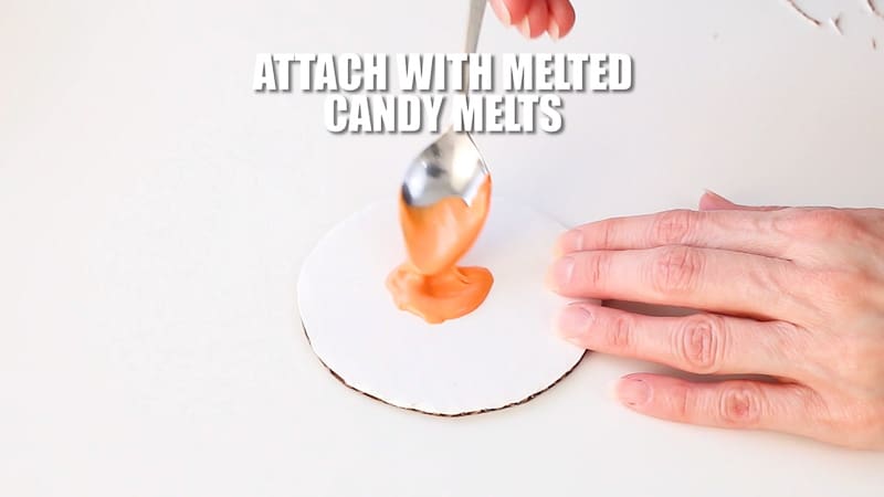 adding melted candy melts to pumpkin cake base