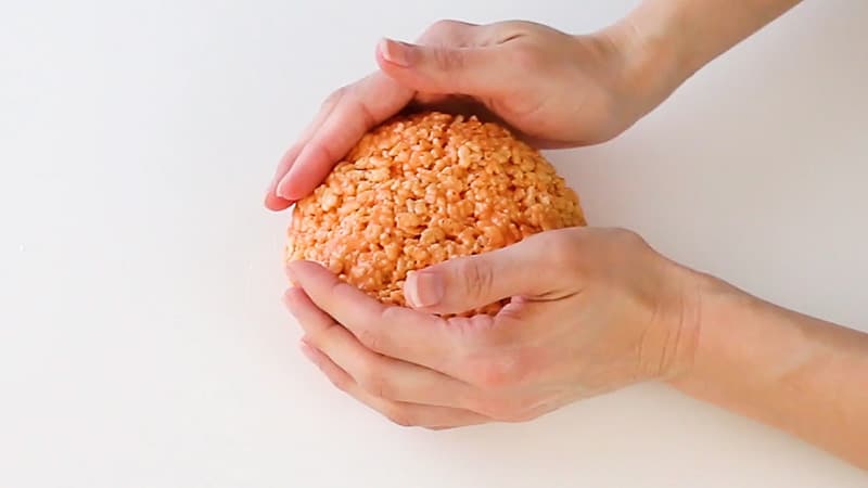 shaping the rice krispie treat pumpkin