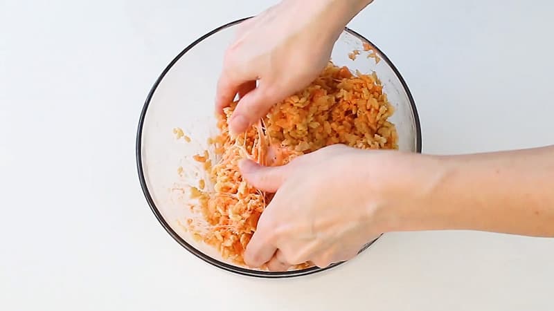 mixing orange rice krispie treats