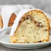Slice of cinnamon swirl sour cream cake on a white plate