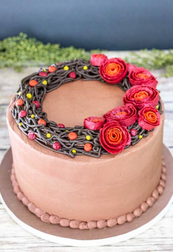 chocolate wreath cake with red ribbon roses