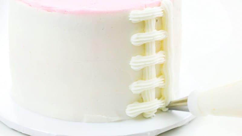 piping a basketweave on a cake