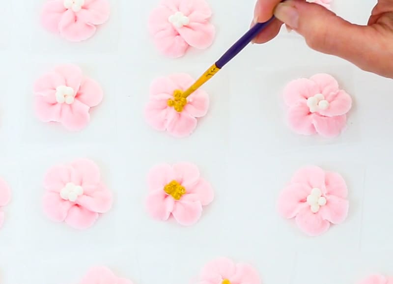 add gold luster dust to middle of apple blossoms