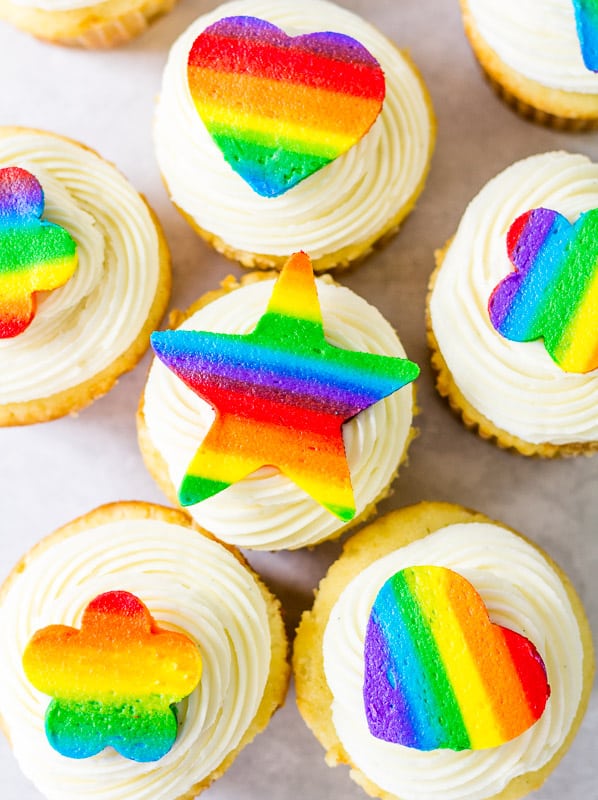 rainbow buttercream cutouts on top of cupcakes