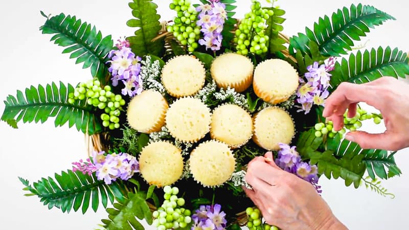 adjust the flowers in the cupcake bouquet basket