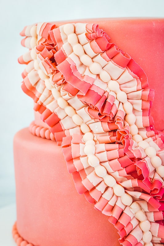 fondant cake with gathered fondant ruffles and pearls