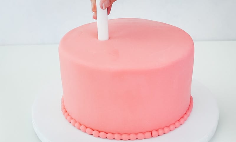 pull the poly dowel out of the cake