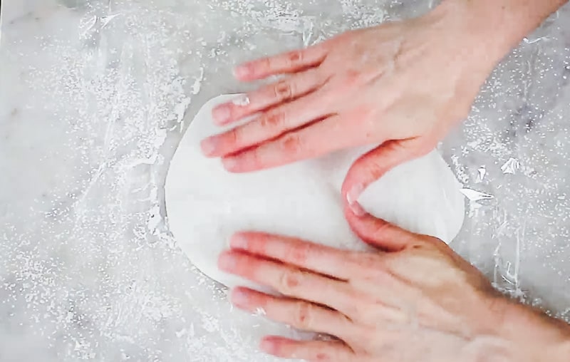 place a piece of plastic wrap over the white fondant