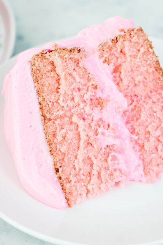 Close up of pink cake with pink icing.
