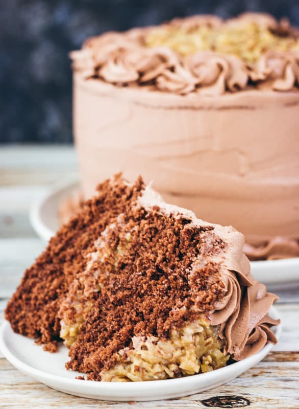 large slice of german chocolate cake on a white plate