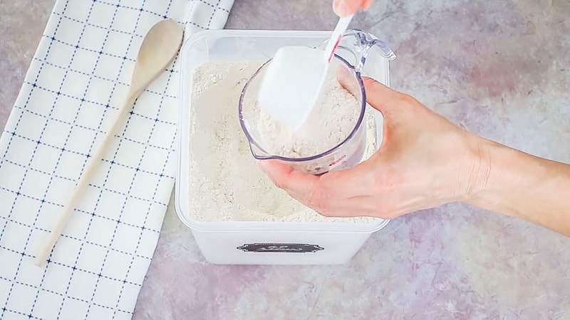 measuring flour in a liquid measuring cup