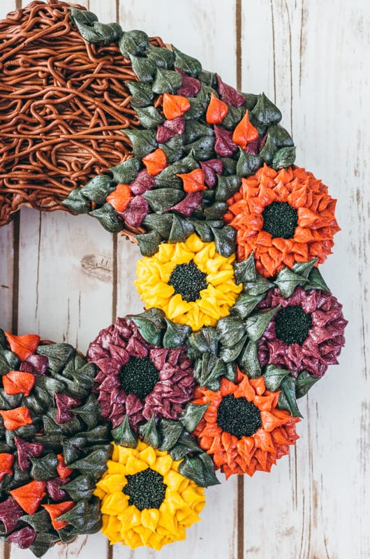 close up of fall buttercream piped flower cupcakes