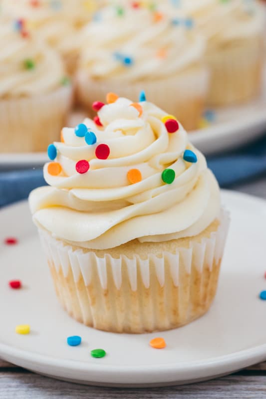 cake batter buttercream on a cupcake with sprinkles
