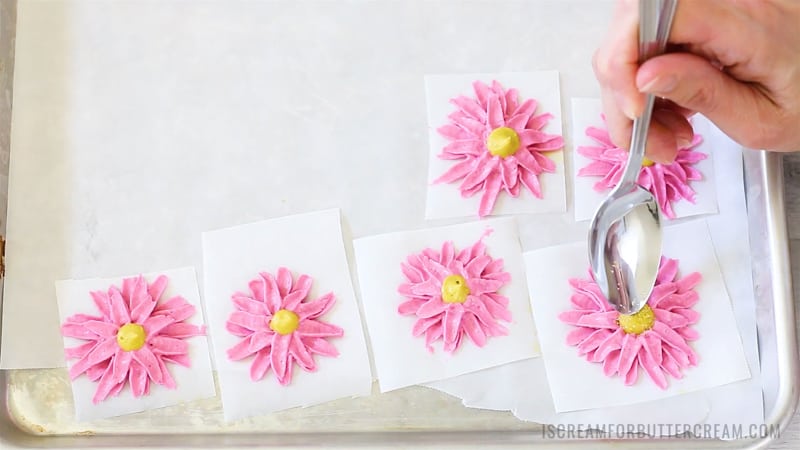 Add yellow sprinkles to middle of buttercream daisies.