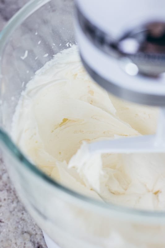 buttercream in a mixing bowl with a beater